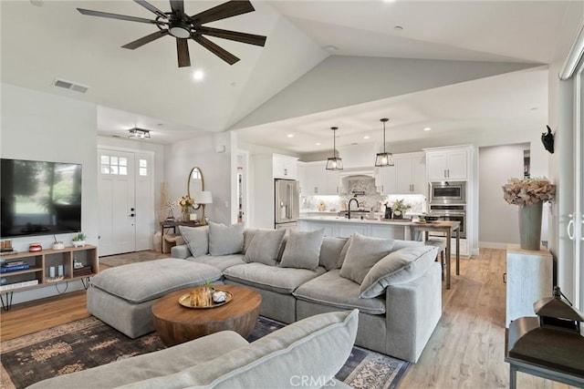 212 Valley View Dr, Paradise, CA 95969 - living area featuring a ceiling fan, recessed lighting, light wood-style floors, and high vaulted ceiling