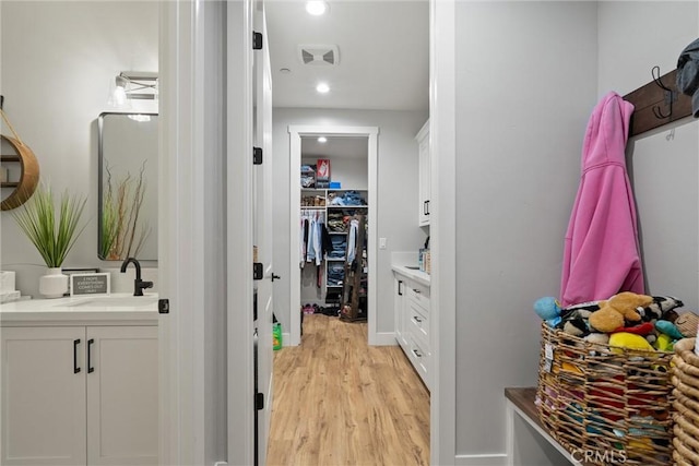 212 Valley View Dr, Paradise, CA 95969 - walk in closet featuring a sink and light wood-type flooring