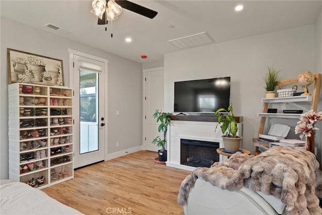 212 Valley View Dr, Paradise, CA 95969 - living room with ceiling fan, wood finished floors, a fireplace, and recessed lighting