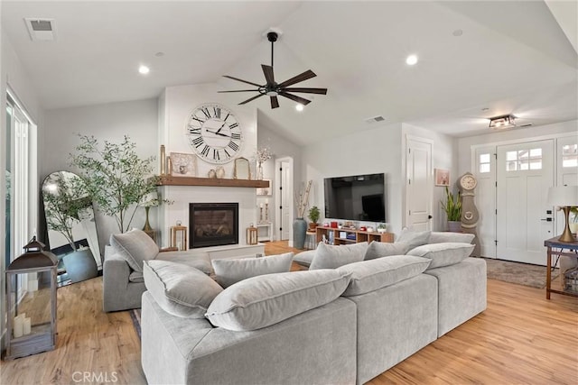 212 Valley View Dr, Paradise, CA 95969 - living area with a ceiling fan, a glass covered fireplace, plenty of natural light, light wood finished floors, and recessed lighting