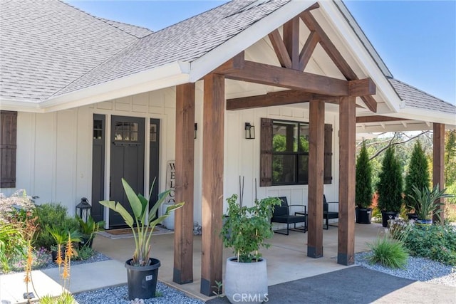 212 Valley View Dr, Paradise, CA 95969 - property entrance with roof with shingles, board and batten siding, and covered porch