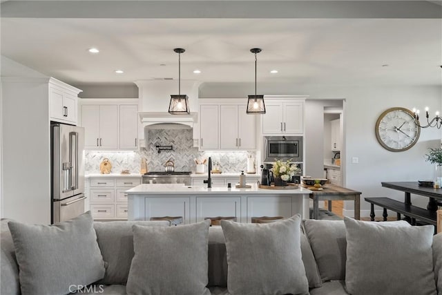 212 Valley View Dr, Paradise, CA 95969 - kitchen featuring stainless steel appliances, open floor plan, white cabinets, backsplash, and light countertops