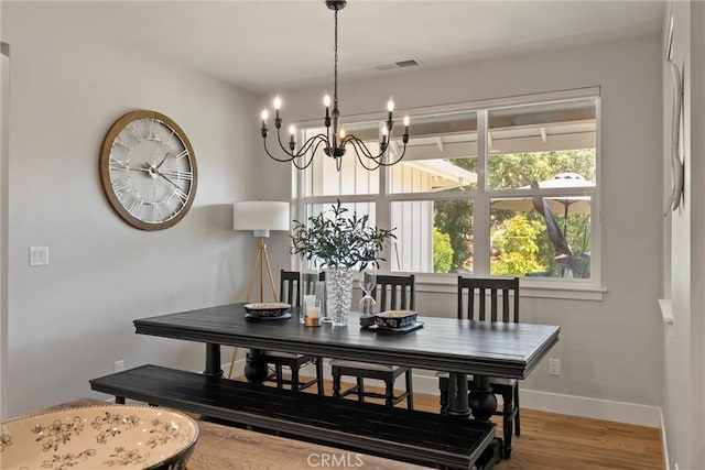 212 Valley View Dr, Paradise, CA 95969 - dining space featuring a chandelier, healthy amount of natural light, and wood finished floors