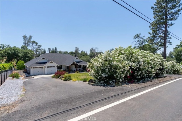 212 Valley View Dr, Paradise, CA 95969 - view of front facade featuring an attached garage and asphalt driveway