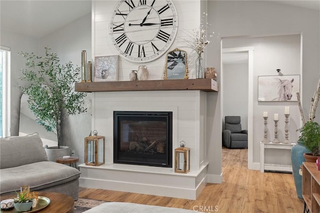 212 Valley View Dr, Paradise, CA 95969 - living area with lofted ceiling, wood finished floors, and a large fireplace