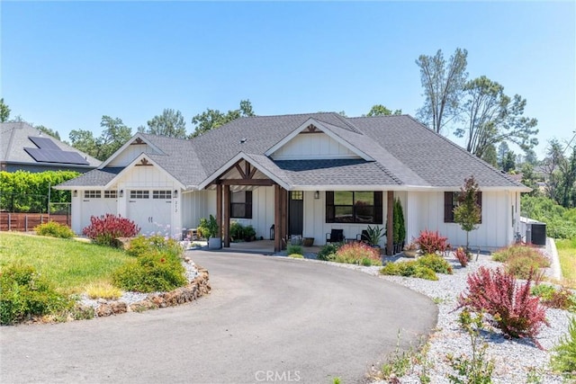 212 Valley View Dr, Paradise, CA 95969 - modern farmhouse style home featuring board and batten siding, an attached garage, curved driveway, and roof with shingles