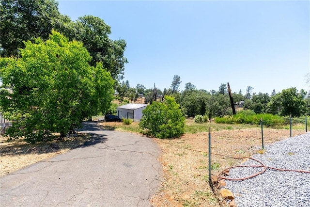 212 Valley View Dr, Paradise, CA 95969 - view of asphalt driveway with view of wooded area