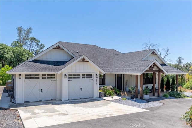 212 Valley View Dr, Paradise, CA 95969 - modern farmhouse style home featuring roof with shingles, a garage, board and batten siding, covered porch, and driveway