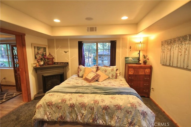 32383 Pine Manor Ln Unit 634, Running Springs, CA 92382 - bedroom with a tray ceiling and a fireplace