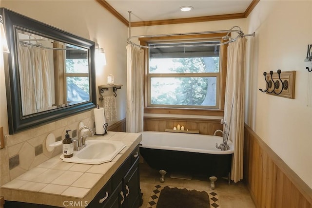 32383 Pine Manor Ln Unit 634, Running Springs, CA 92382 - full bathroom featuring a soaking tub, vanity, healthy amount of natural light, a wainscoted wall, and crown molding
