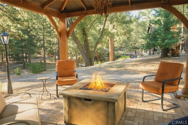 32383 Pine Manor Ln Unit 634, Running Springs, CA 92382 - view of patio featuring a fire pit and a gazebo