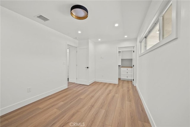 19548 Cedarcreek St, Canyon Country, CA 91351 - empty room with light wood-style floors and recessed lighting