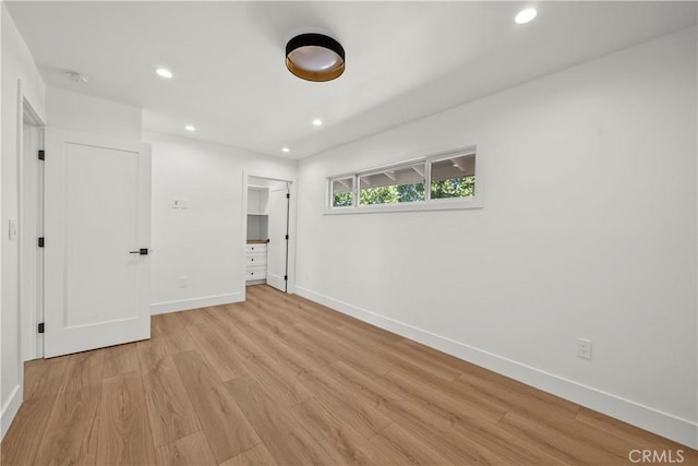 19548 Cedarcreek St, Canyon Country, CA 91351 - unfurnished bedroom featuring light wood-type flooring, recessed lighting, and a closet