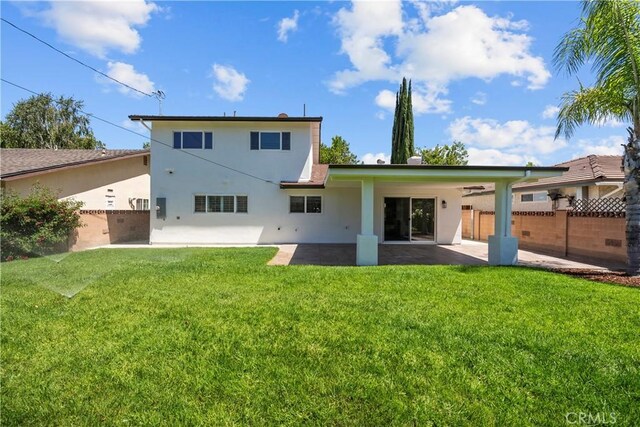 19548 Cedarcreek St, Canyon Country, CA 91351 - rear view of house featuring a patio area and stucco siding