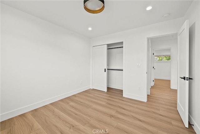 19548 Cedarcreek St, Canyon Country, CA 91351 - unfurnished bedroom featuring light wood-style floors, recessed lighting, and a closet