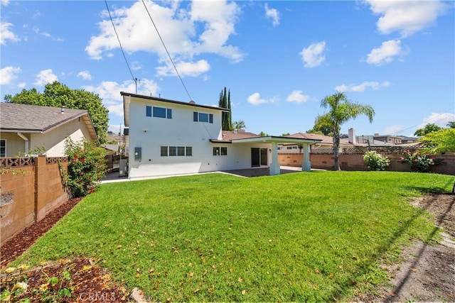 19548 Cedarcreek St, Canyon Country, CA 91351 - back of house with stucco siding, a patio area, and a fenced backyard