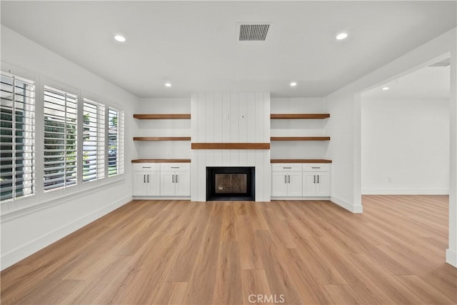 19548 Cedarcreek St, Canyon Country, CA 91351 - unfurnished living room featuring a fireplace, light wood-style floors, and recessed lighting