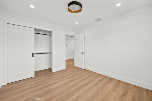 19548 Cedarcreek St, Canyon Country, CA 91351 - unfurnished bedroom with light wood finished floors, a closet, and recessed lighting