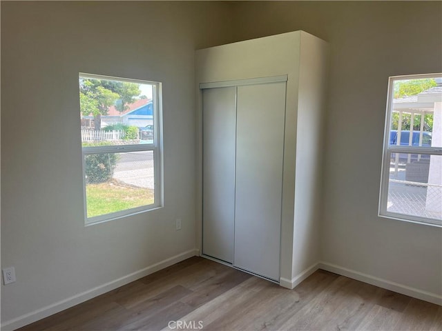 1231 Webster St, Redlands, CA 92374 - unfurnished bedroom featuring light wood-type flooring and a closet
