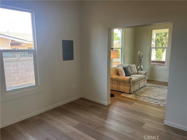 1231 Webster St, Redlands, CA 92374 - spare room featuring electric panel and wood finished floors