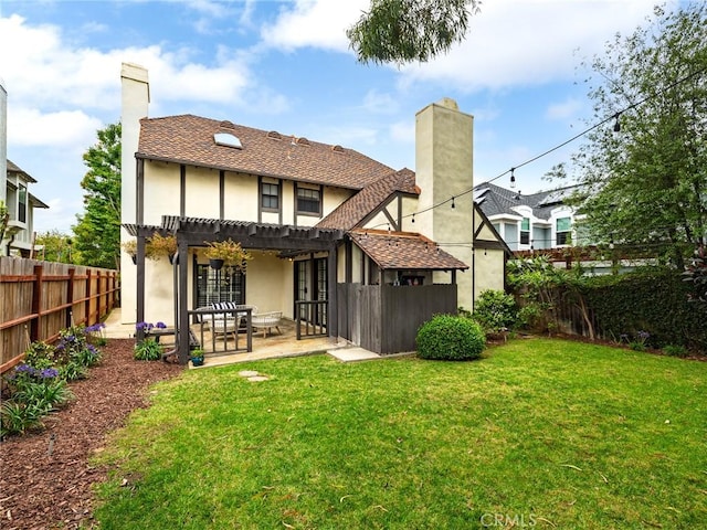 502 Washington St, El Segundo, CA 90245 - back of property with a pergola, a fenced backyard, stucco siding, a patio, and a chimney