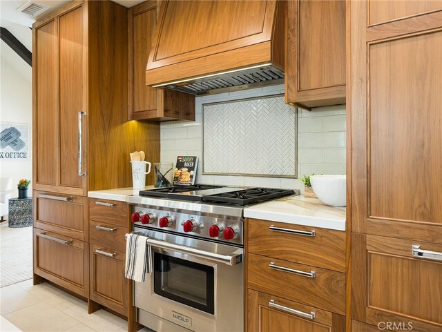 502 Washington St, El Segundo, CA 90245 - kitchen featuring designer stove, brown cabinets, and light countertops