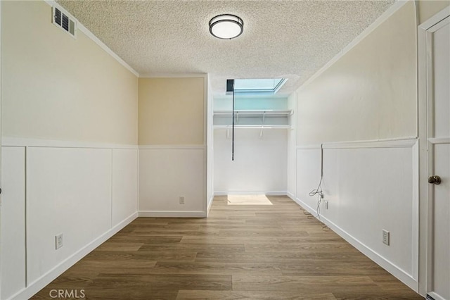 750 Via Los Santos, San Dimas, CA 91773 - additional living space with a textured ceiling, wood finished floors, and a skylight