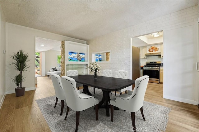 750 Via Los Santos, San Dimas, CA 91773 - dining space featuring a textured ceiling and light wood-style flooring