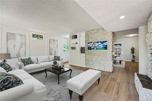 750 Via Los Santos, San Dimas, CA 91773 - living area featuring a textured ceiling and wood finished floors