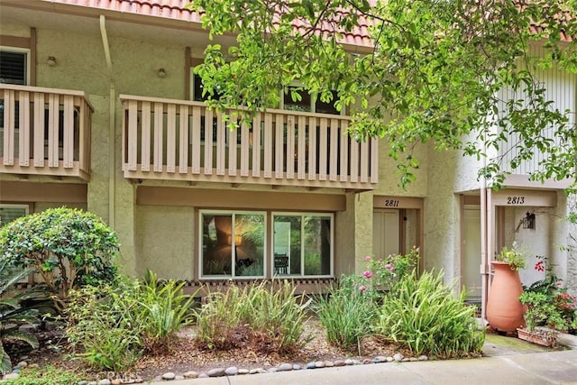 2811 Via Topacio, Carlsbad, CA 92010 - back of house featuring stucco siding, a tiled roof, and a balcony