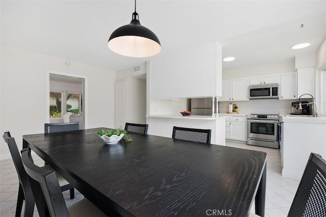 2811 Via Topacio, Carlsbad, CA 92010 - dining space with light tile patterned floors and a fireplace