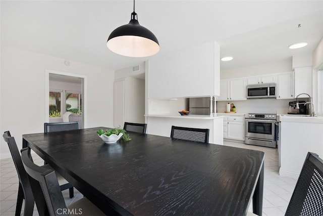 2811 Via Topacio, Carlsbad, CA 92010 - dining room with light tile patterned floors and a fireplace