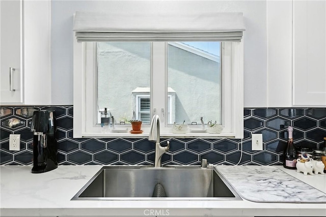 7604 Forest Ave, Whittier, CA 90602 - kitchen view of white cabinets, backsplash, and light stone counters
