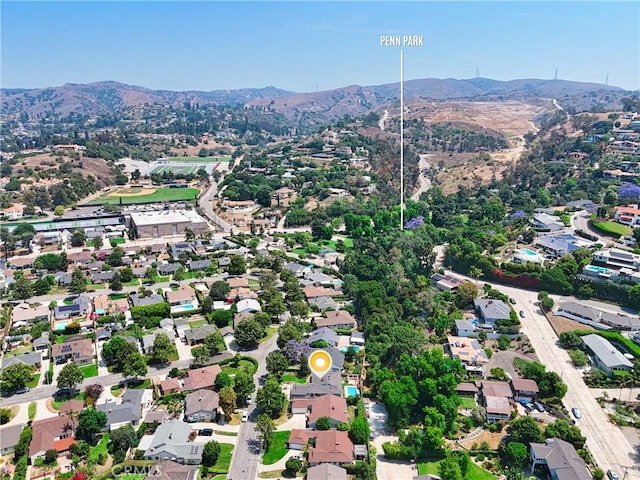 7604 Forest Ave, Whittier, CA 90602 - aerial view of property and surrounding area featuring a mountain backdrop and nearby suburban area