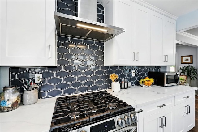 7604 Forest Ave, Whittier, CA 90602 - kitchen with appliances with stainless steel finishes, wall chimney range hood, decorative backsplash, light stone countertops, and white cabinetry