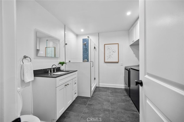 644 Kenoak Dr, Placentia, CA 92870 - bathroom featuring washer and clothes dryer, vanity, a shower stall, and recessed lighting