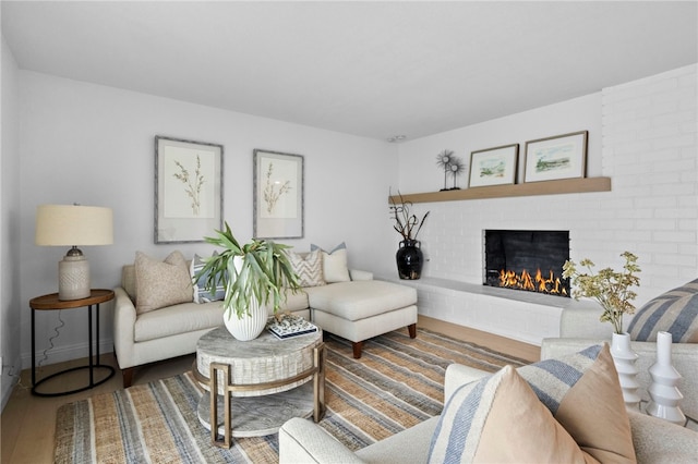 644 Kenoak Dr, Placentia, CA 92870 - living area featuring a brick fireplace and wood finished floors