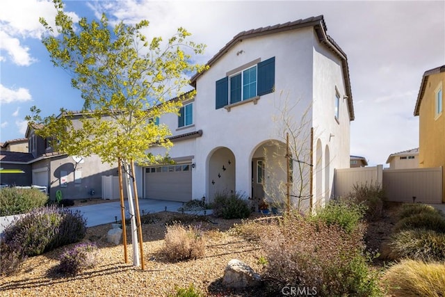 10757 Morgan Ct, Hesperia, CA 92345 - mediterranean / spanish-style home featuring a garage, stucco siding, and concrete driveway