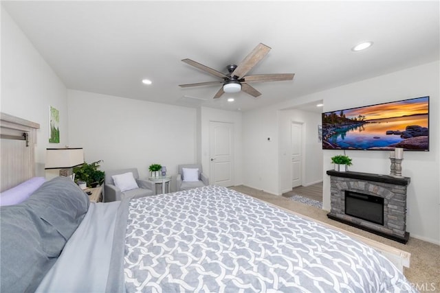 10757 Morgan Ct, Hesperia, CA 92345 - carpeted bedroom with recessed lighting, a stone fireplace, and ceiling fan