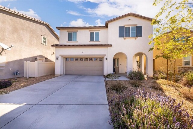 10757 Morgan Ct, Hesperia, CA 92345 - mediterranean / spanish-style home featuring a tile roof, a garage, stucco siding, and concrete driveway