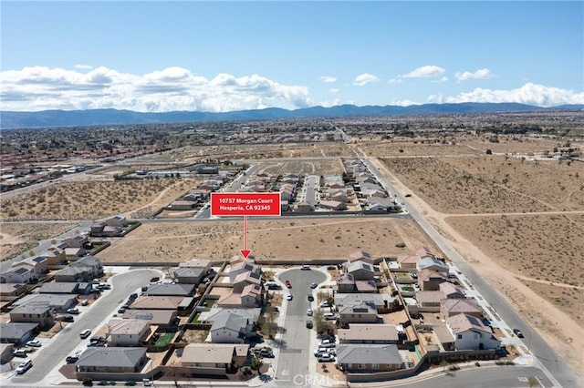 10757 Morgan Ct, Hesperia, CA 92345 - aerial view of property and surrounding area featuring a mountainous background and nearby suburban area