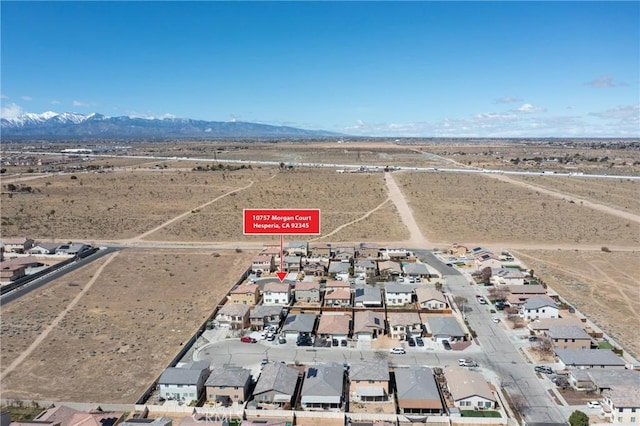 10757 Morgan Ct, Hesperia, CA 92345 - aerial view of property's location with a mountain backdrop and nearby suburban area