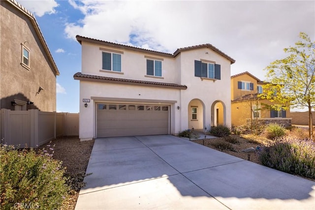 10757 Morgan Ct, Hesperia, CA 92345 - mediterranean / spanish-style home with driveway, a garage, stucco siding, and a tile roof
