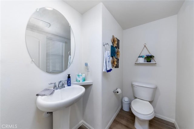 10757 Morgan Ct, Hesperia, CA 92345 - bathroom featuring wood finished floors and toilet