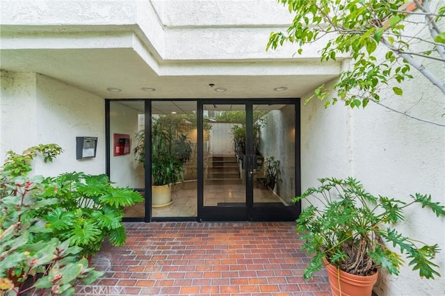 432 S Hamel Rd Unit 302, Los Angeles, CA 90048 - doorway to property featuring stucco siding