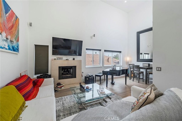 432 S Hamel Rd Unit 302, Los Angeles, CA 90048 - living room with a high ceiling, wood finished floors, and a fireplace