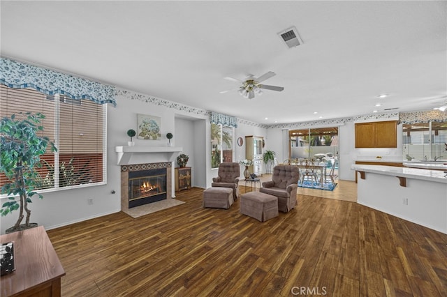 20865 Westbury Rd, Riverside, CA 92508 - living area featuring ceiling fan, wood finished floors, a tile fireplace, and recessed lighting