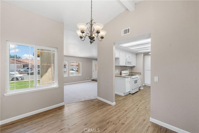 4633 Dowel Ave, Palmdale, CA 93552 - unfurnished dining area featuring a chandelier, beamed ceiling, light wood-style floors, and high vaulted ceiling