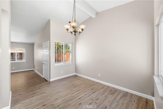 4633 Dowel Ave, Palmdale, CA 93552 - unfurnished room with a chandelier, plenty of natural light, and wood finished floors