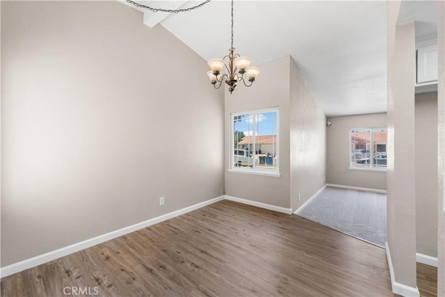 4633 Dowel Ave, Palmdale, CA 93552 - spare room with a chandelier, plenty of natural light, wood finished floors, and lofted ceiling